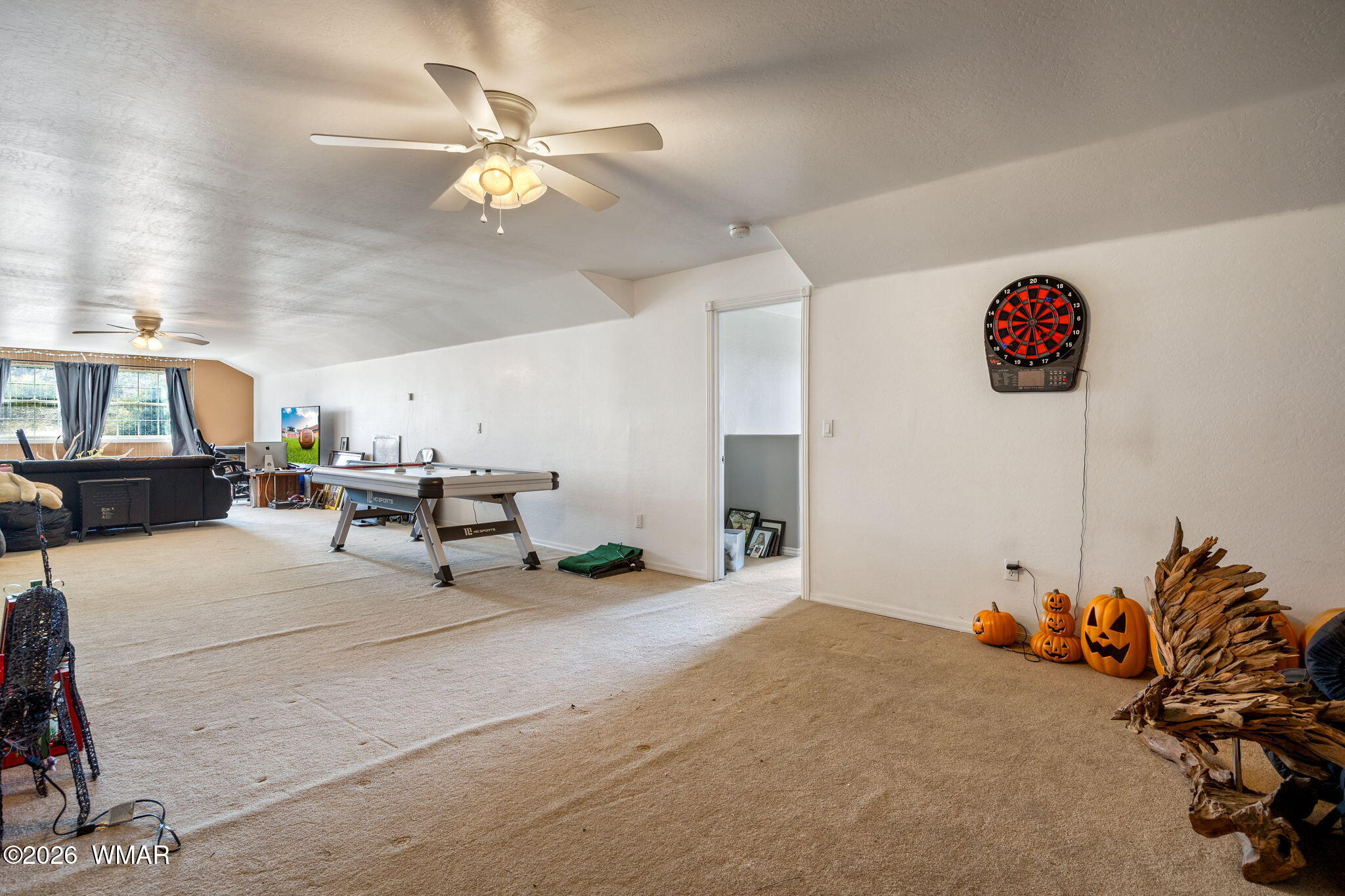 1940 Stonegate Way Heber, AZ 85928 - Photo 41 of 62 a very nice looking room with a large window and chandelier fan