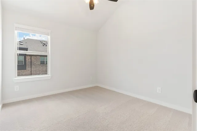 a view of empty room with windows