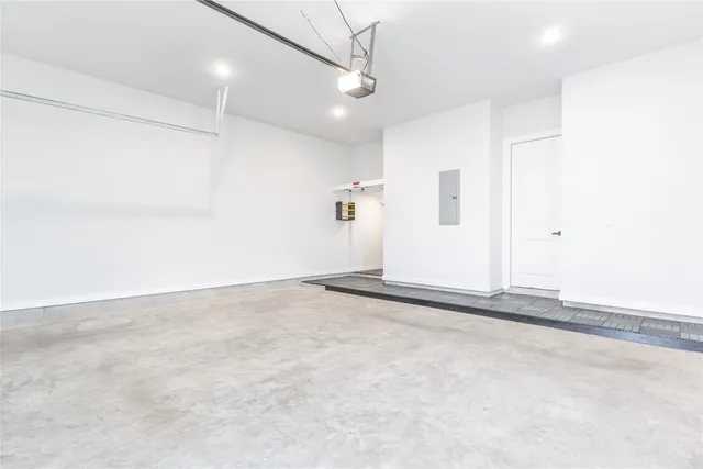 an empty room with a ceiling fan and window