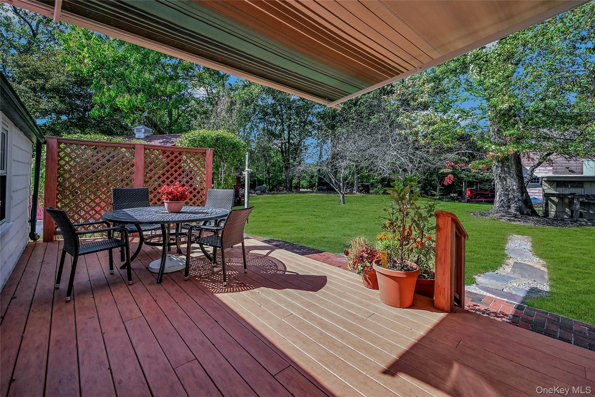 147 North Country Road Mount Sinai, NY 11766 - Photo 13 of 16 Backdeck with Awning