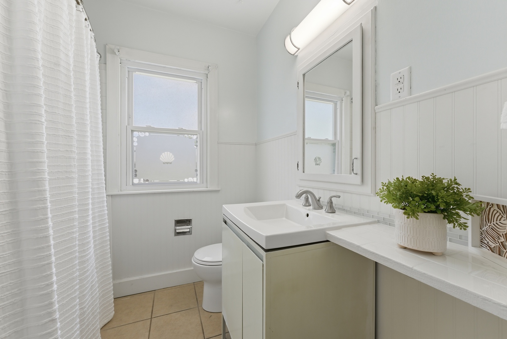 2405 31st Street Moline, IL 61265 - Photo 11 of 24 a bathroom with a sink toilet and a mirror