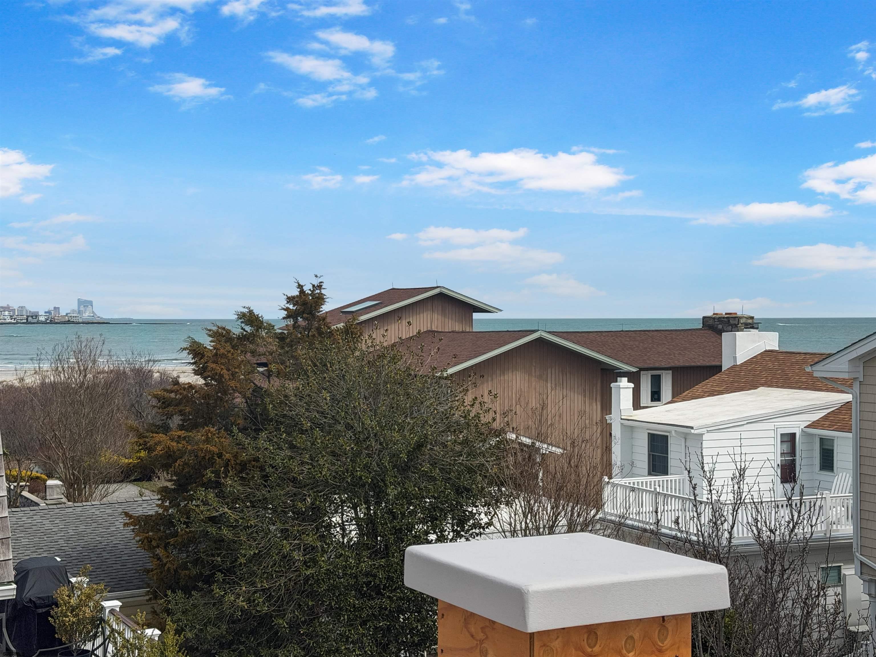 905 Seacrest Road Ocean City, NJ 08226 - Photo 12 of 18 a view of a house with a backyard and a tree