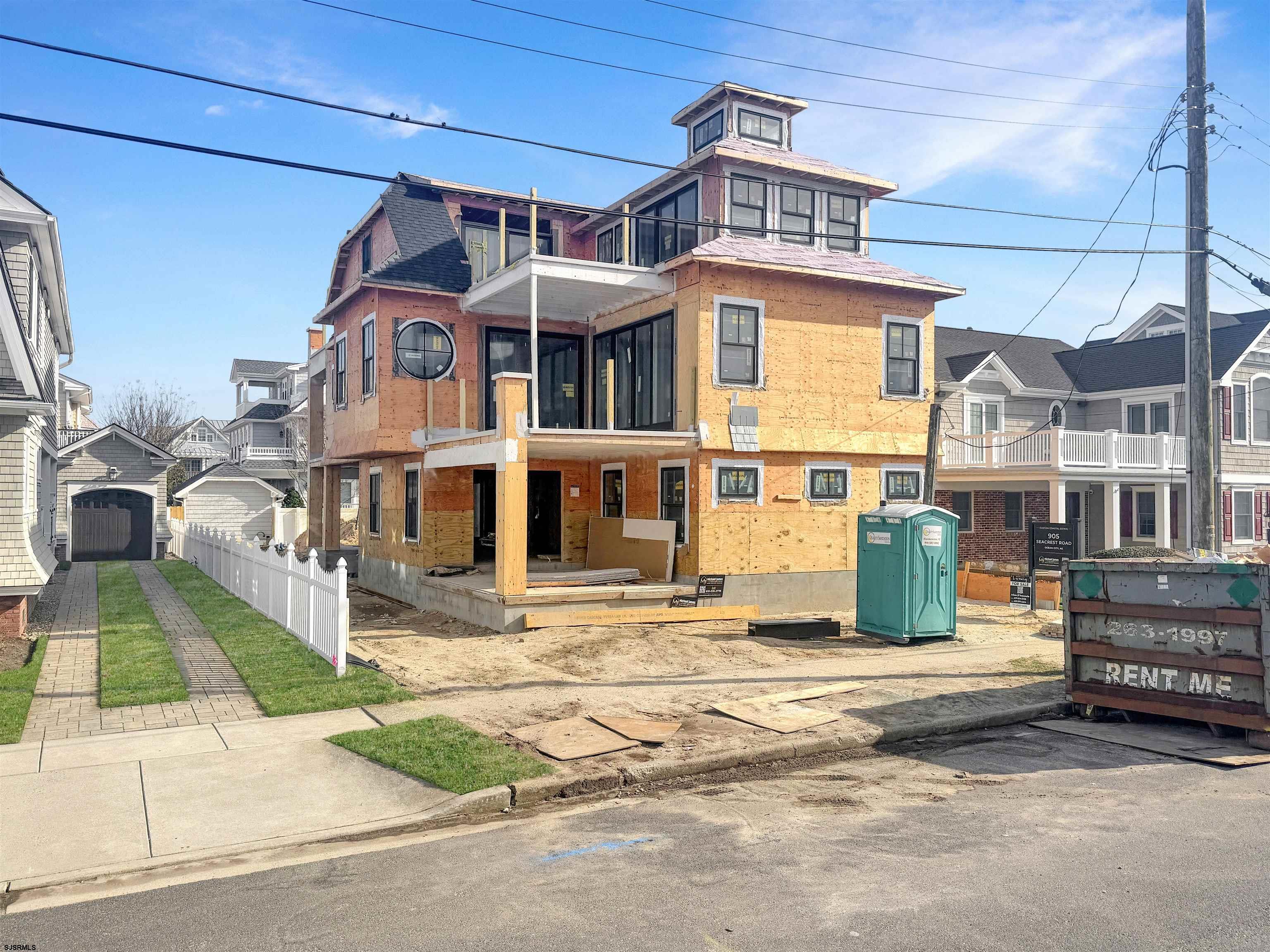 905 Seacrest Road Ocean City, NJ 08226 - Photo 3 of 18 a front view of a building with a garden and parking space