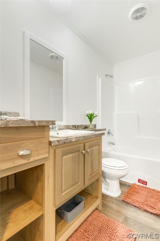 1055 Eastham Road Bumpass, VA 23024 - Photo 18 of 42 a bathroom with a granite countertop toilet a sink and a bathtub