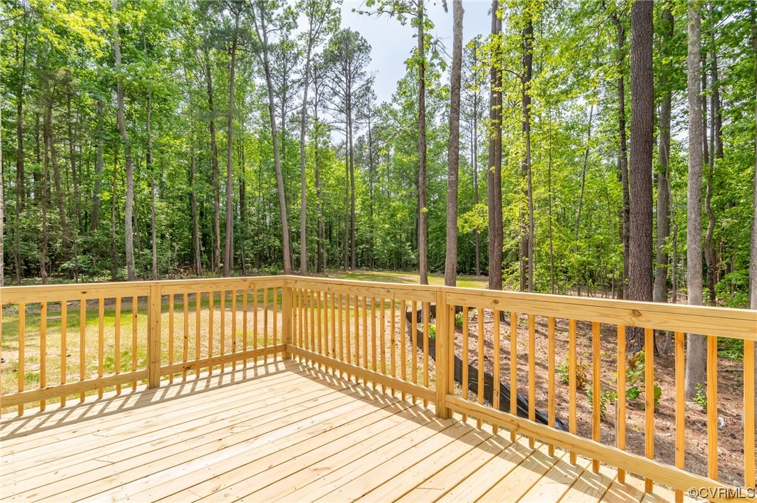 1055 Eastham Road Bumpass, VA 23024 - Photo 23 of 42 a view of a wooden deck next to a yard