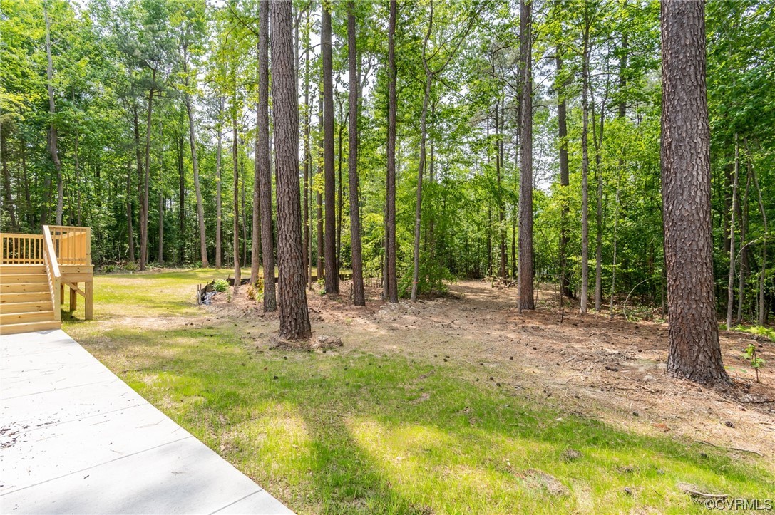 1055 Eastham Road Bumpass, VA 23024 - Photo 24 of 42 a swimming pool with outdoor seating and yard