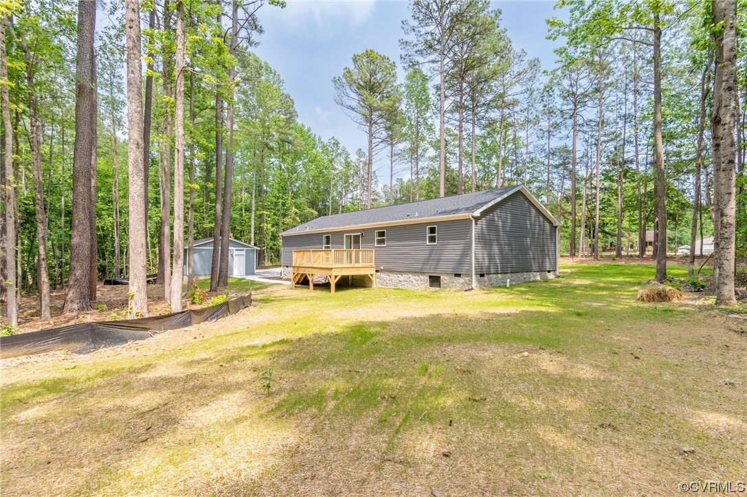 1055 Eastham Road Bumpass, VA 23024 - Photo 26 of 42 a front view of house with yard and swimming pool