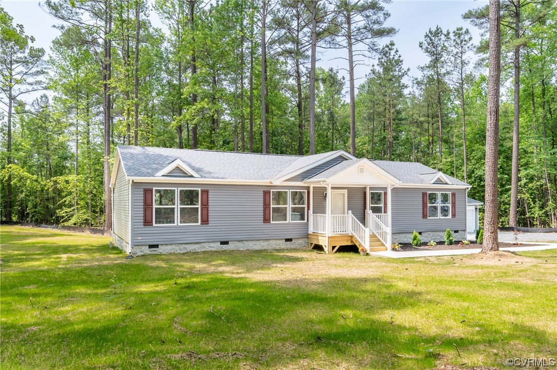 1055 Eastham Road Bumpass, VA 23024 - Photo 4 of 42 a house view with a garden space