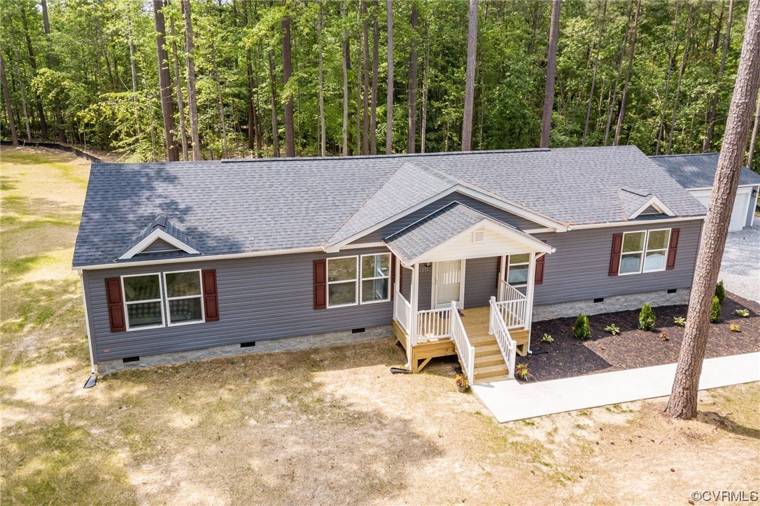 1055 Eastham Road Bumpass, VA 23024 - Photo 42 of 42 a view of a house with a backyard and pool