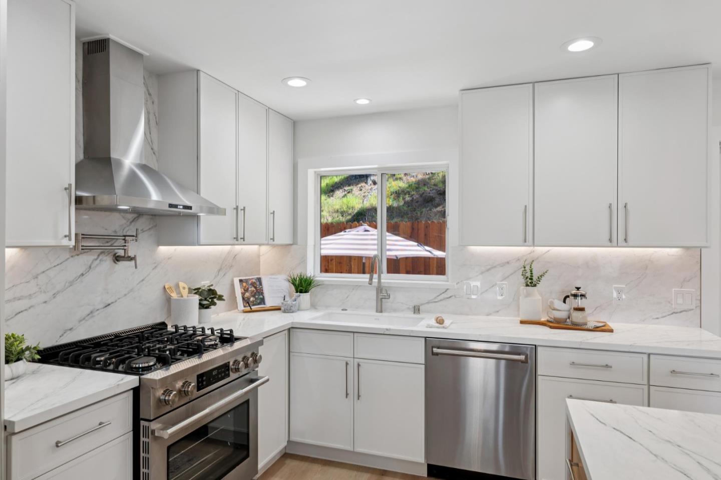 2 Celia Court Pacifica, CA 94044 - Photo 11 of 47 a kitchen with a sink stove and cabinets