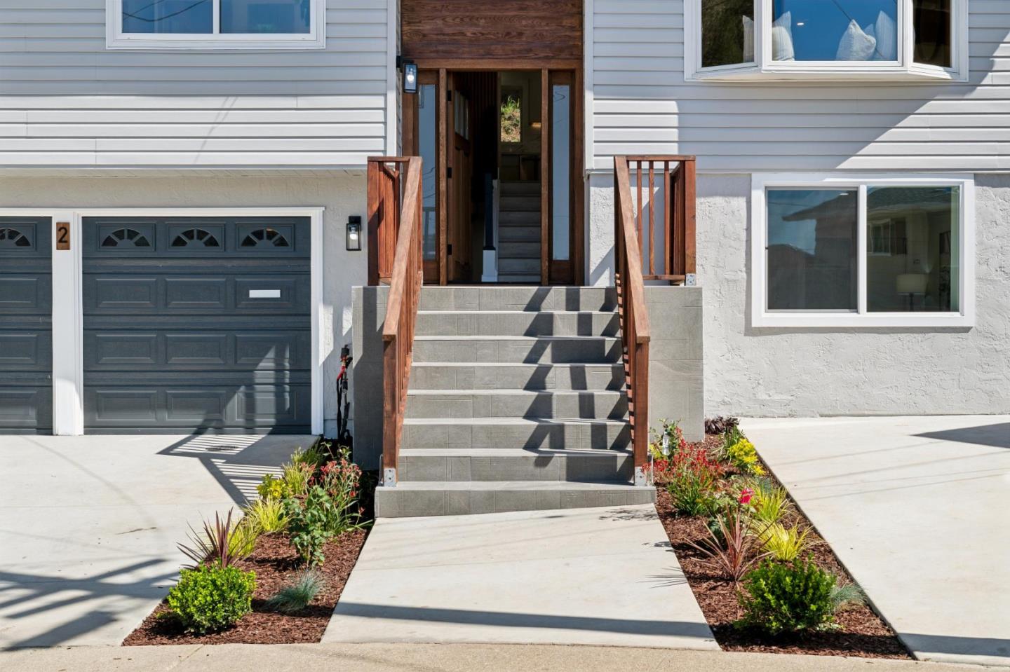 2 Celia Court Pacifica, CA 94044 - Photo 2 of 47 a front view of a house with a garden