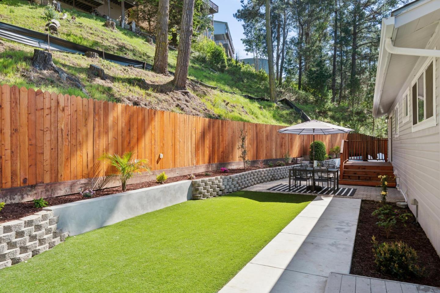 2 Celia Court Pacifica, CA 94044 - Photo 34 of 47 a view of a backyard with a patio and outdoor seating
