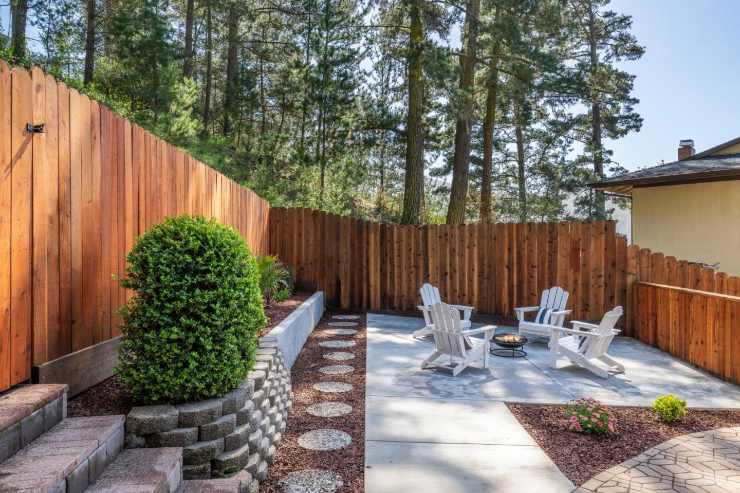 2 Celia Court Pacifica, CA 94044 - Photo 37 of 47 a view of a patio with table and chairs with wooden fence and plants