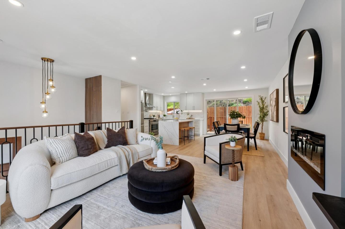 2 Celia Court Pacifica, CA 94044 - Photo 9 of 47 a living room with furniture kitchen view and a wooden floor