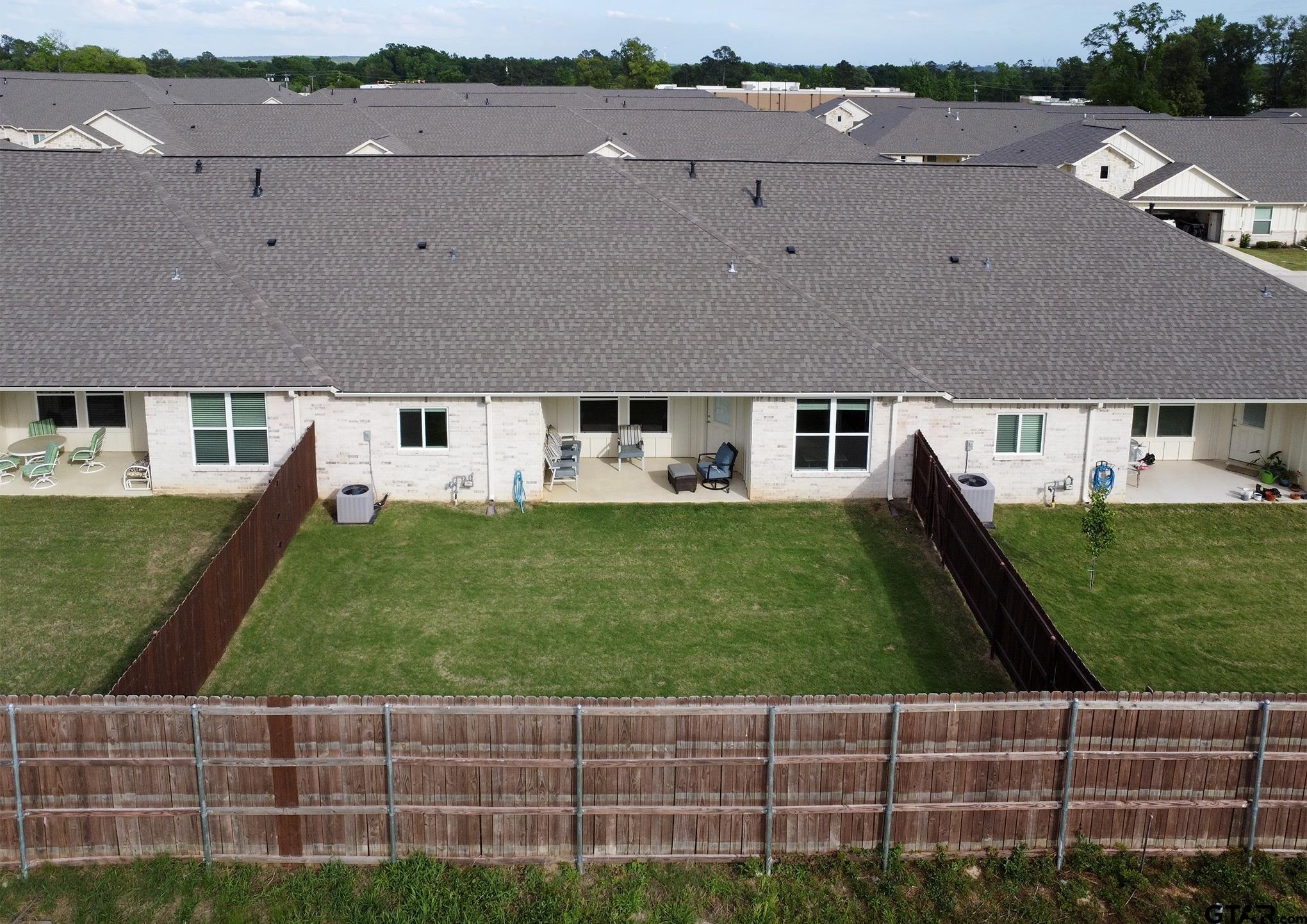 6143 Hamilton Mdws Way Tyler, TX 75703 - Photo 19 of 29 a aerial view of a house with a yard