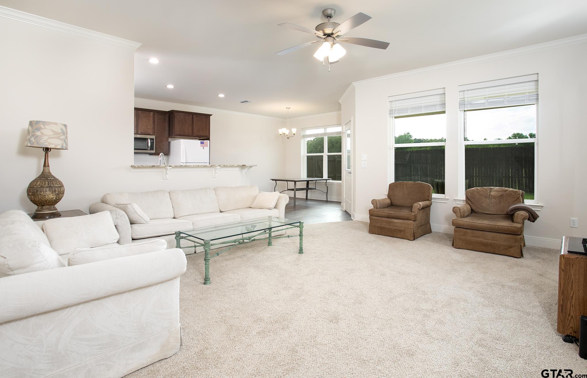 6143 Hamilton Mdws Way Tyler, TX 75703 - Photo 2 of 29 a living room with furniture and a large window
