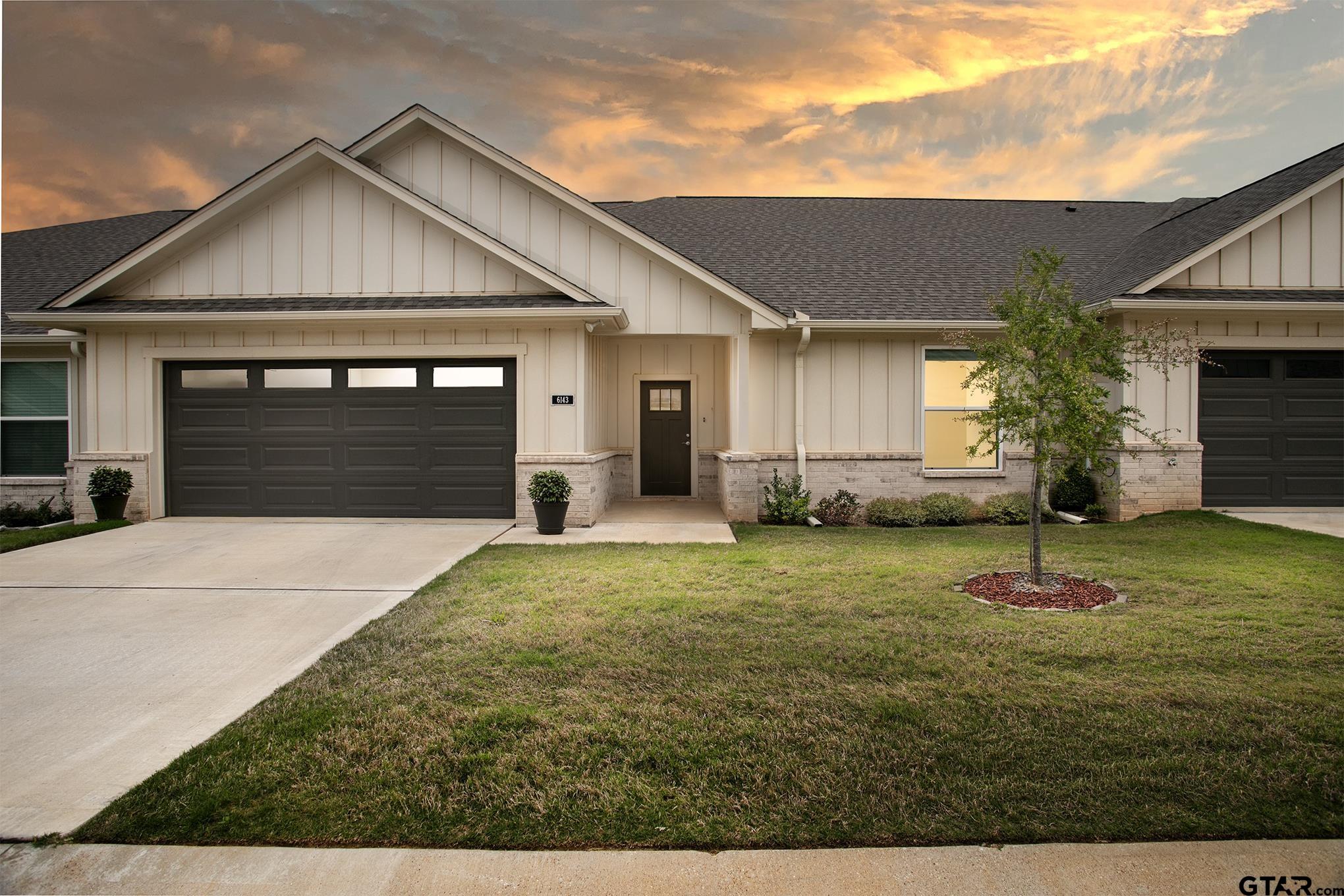 6143 Hamilton Mdws Way Tyler, TX 75703 - Photo 29 of 29 a front view of a house with a yard and garage