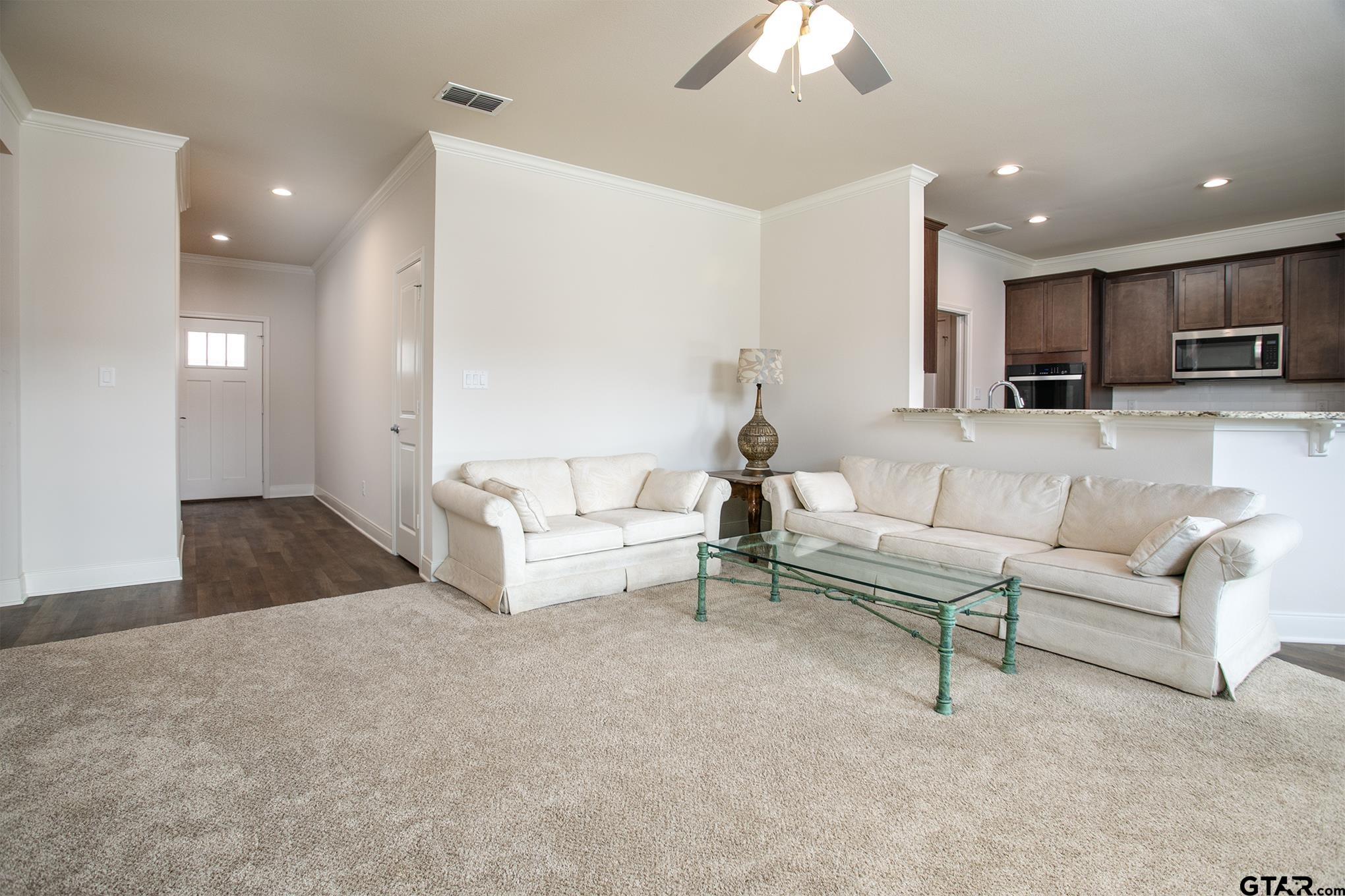 6143 Hamilton Mdws Way Tyler, TX 75703 - Photo 3 of 29 a living room with furniture and a couch