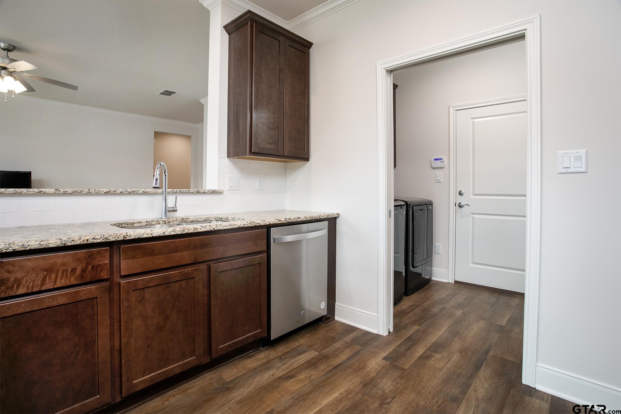 6143 Hamilton Mdws Way Tyler, TX 75703 - Photo 7 of 29 a bathroom with a granite countertop sink and mirror