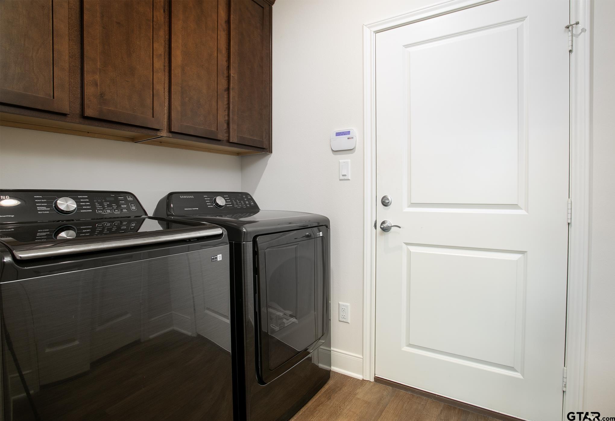 6143 Hamilton Mdws Way Tyler, TX 75703 - Photo 10 of 29 a utility room with washer and dryer