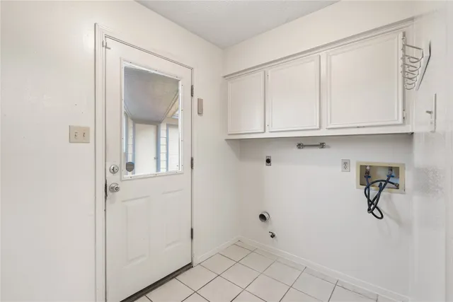 a view of a livingroom with wooden cabinets