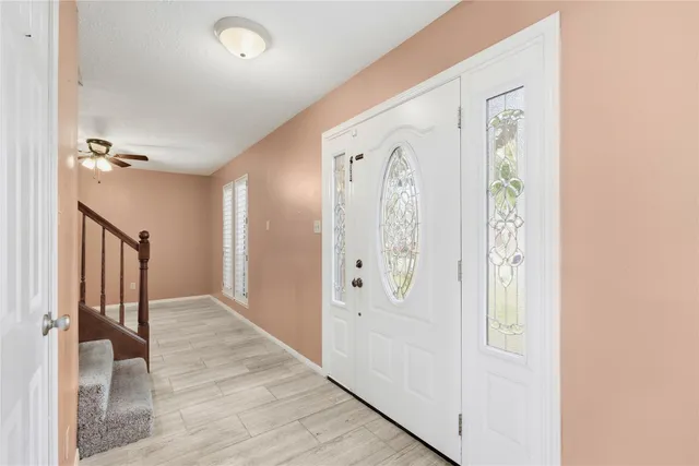 wooden floor with white walls