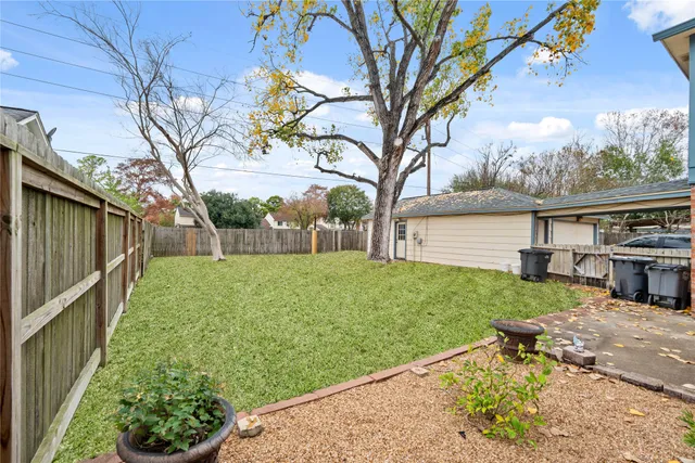 a view of backyard with seating area