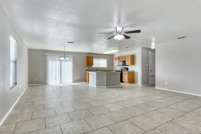 a view of a kitchen with furniture and a kitchen