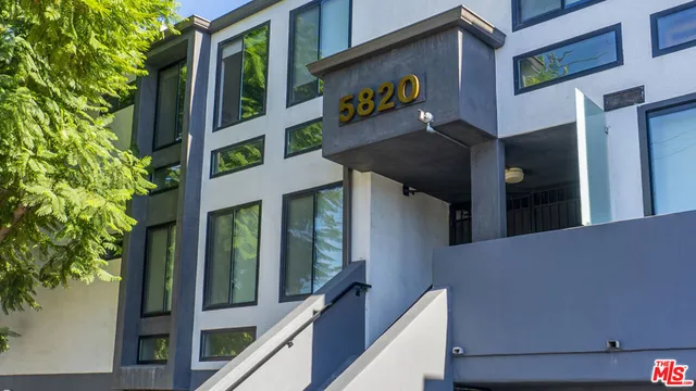 a view of a house with a street