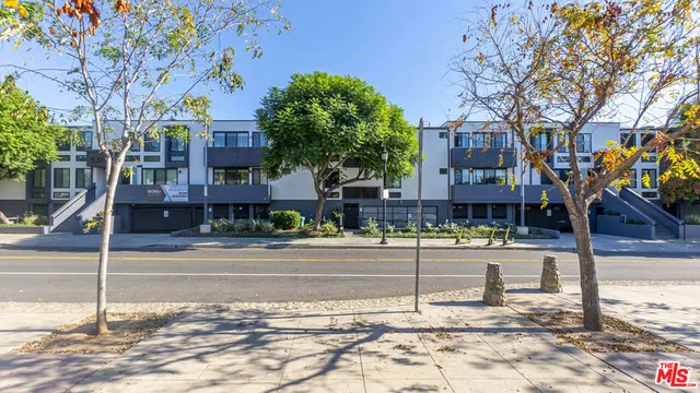 a view of a house with a street