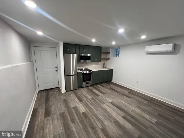 a view of kitchen and refrigerator