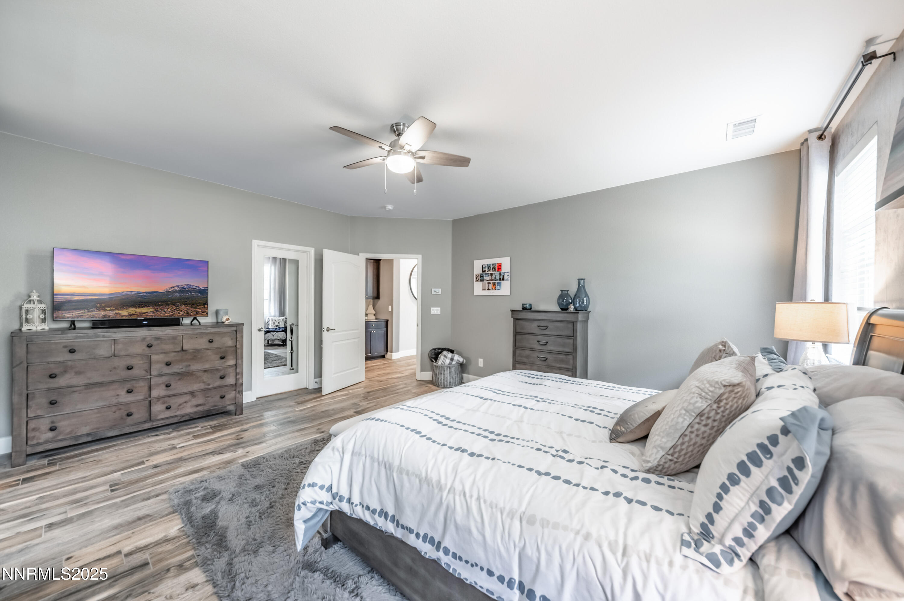 1640 Scott Valley Road Reno, NV 89523 - Photo 12 of 25 a bedroom with a bed and a flat screen tv