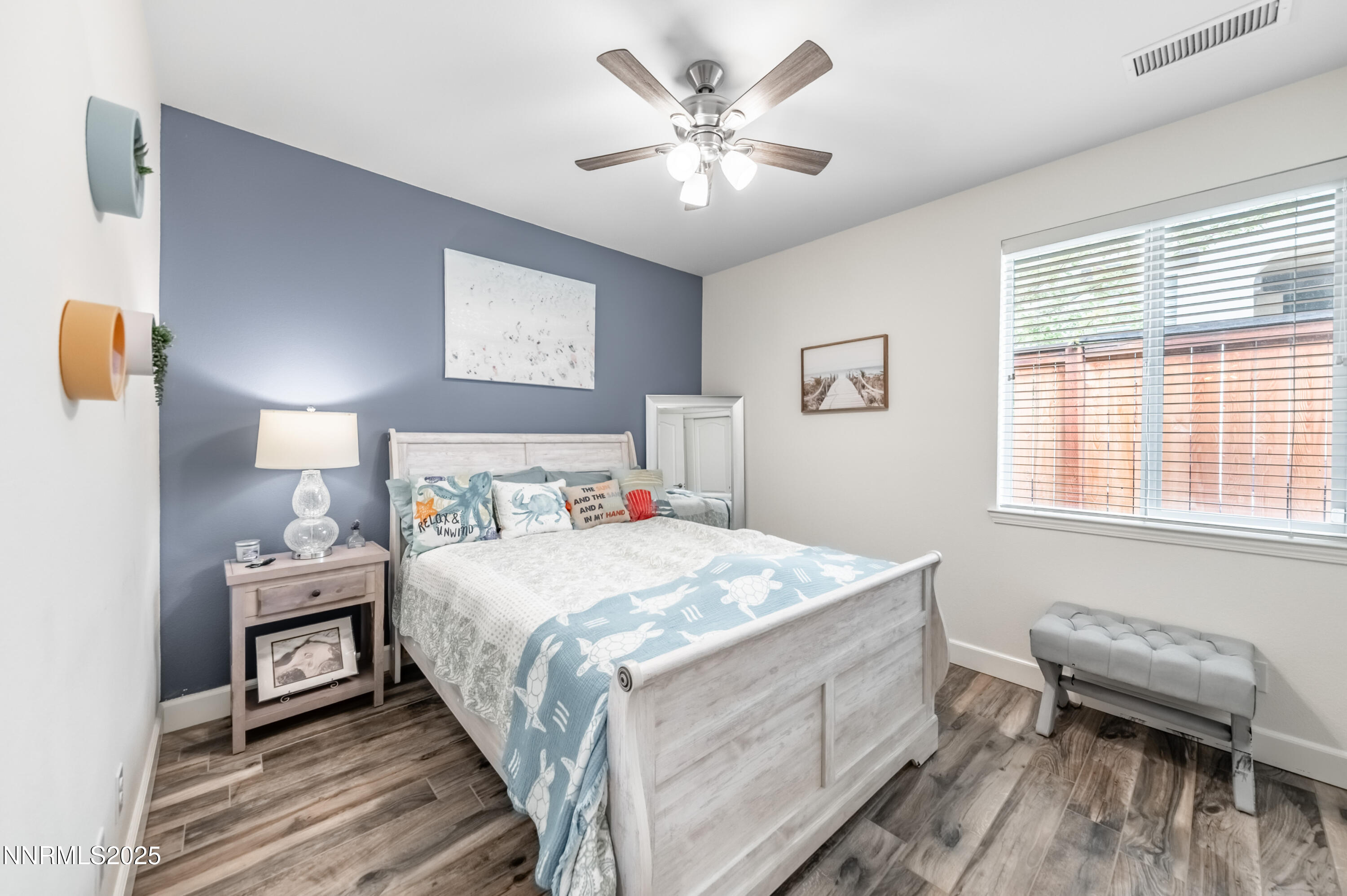 1640 Scott Valley Road Reno, NV 89523 - Photo 16 of 25 a bedroom with a bed and a chandelier