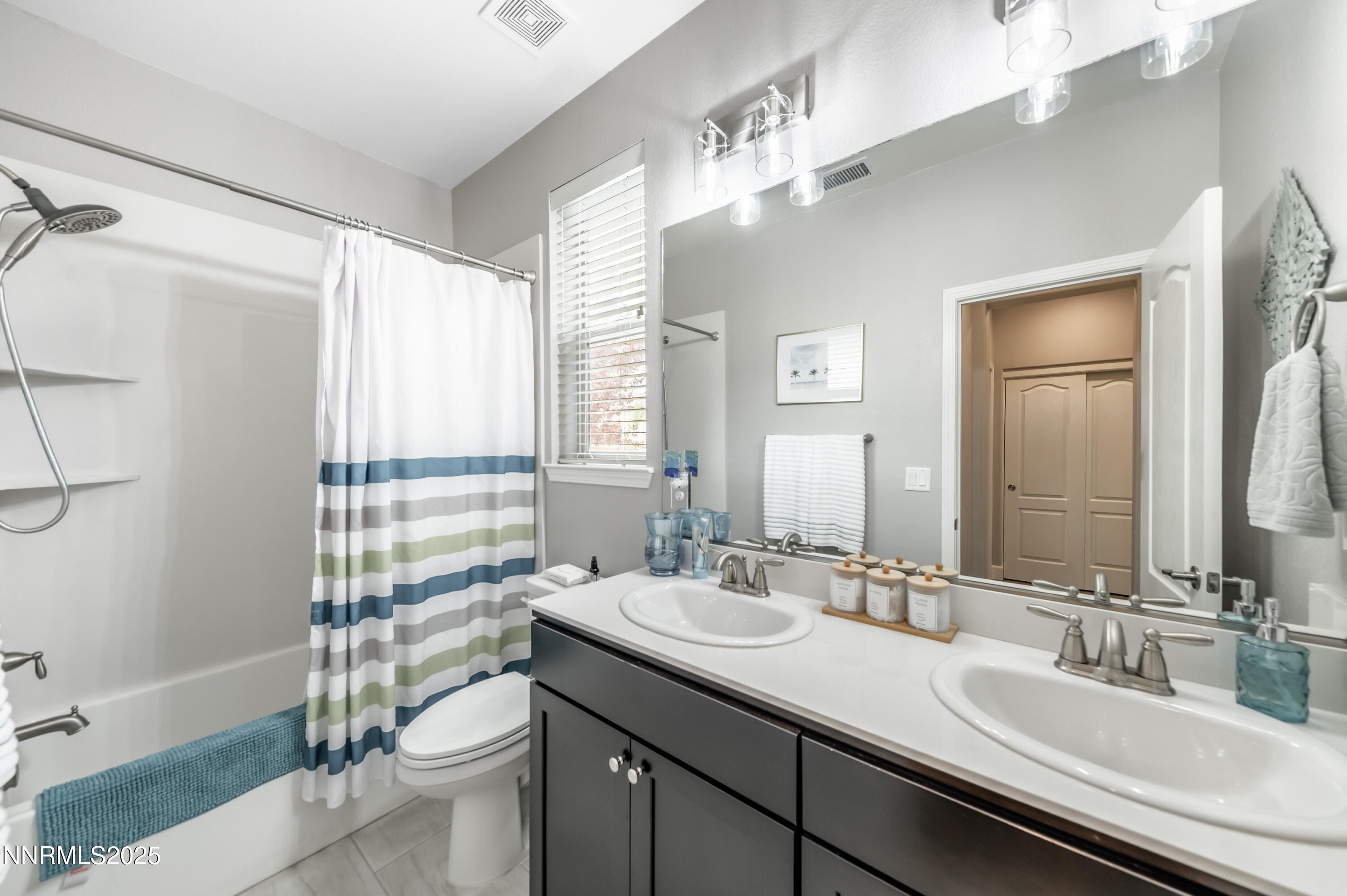 1640 Scott Valley Road Reno, NV 89523 - Photo 18 of 25 a bathroom with a double vanity sink toilet and shower
