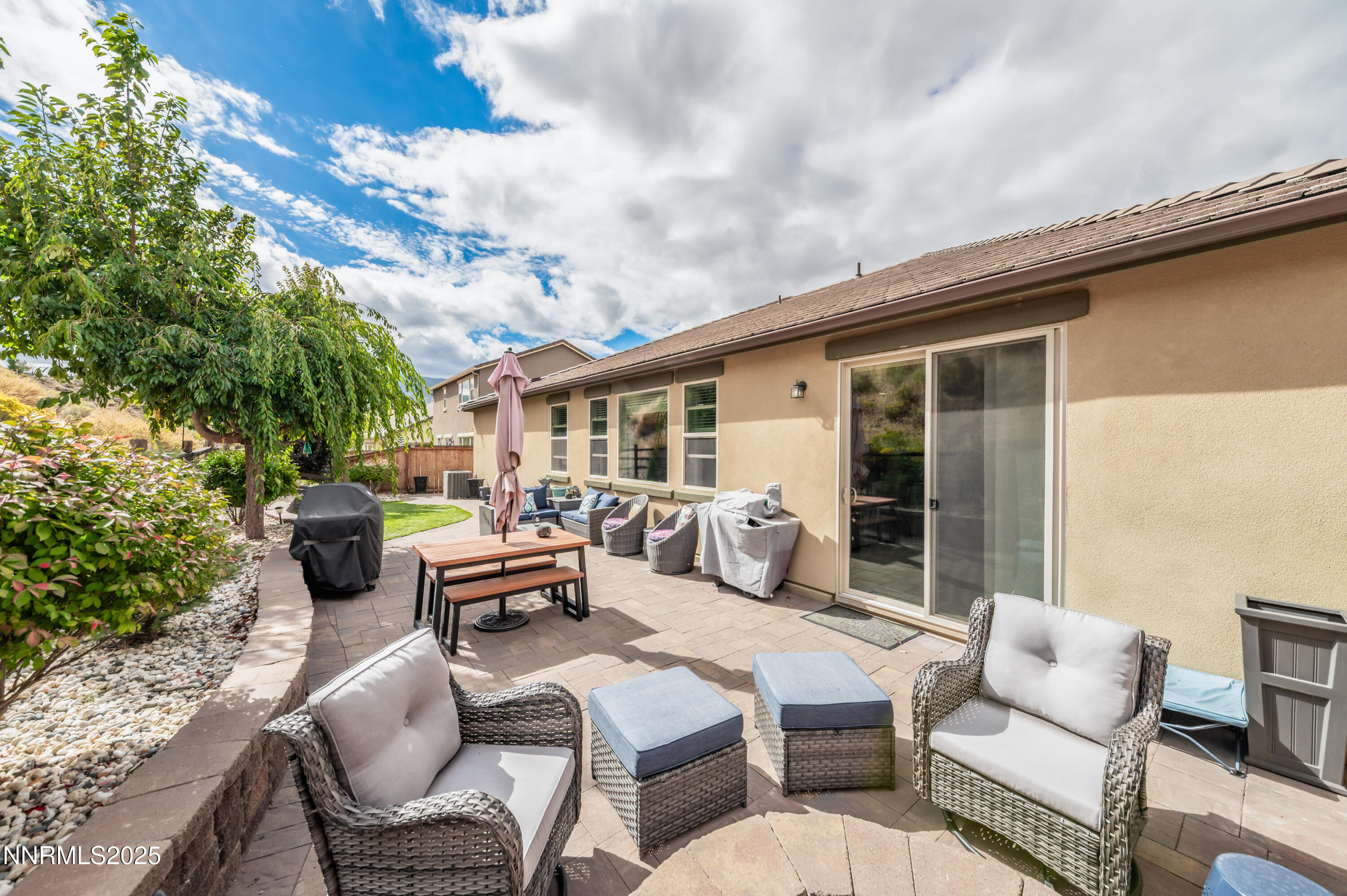 1640 Scott Valley Road Reno, NV 89523 - Photo 20 of 25 a view of a patio with couches table and chairs and potted plants