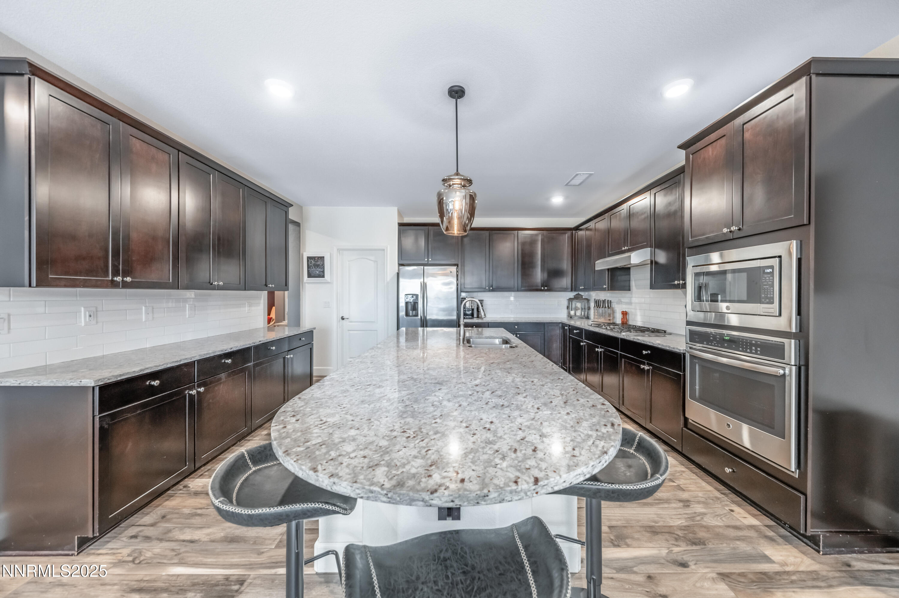1640 Scott Valley Road Reno, NV 89523 - Photo 6 of 25 a kitchen with counter top space cabinets and stainless steel appliances