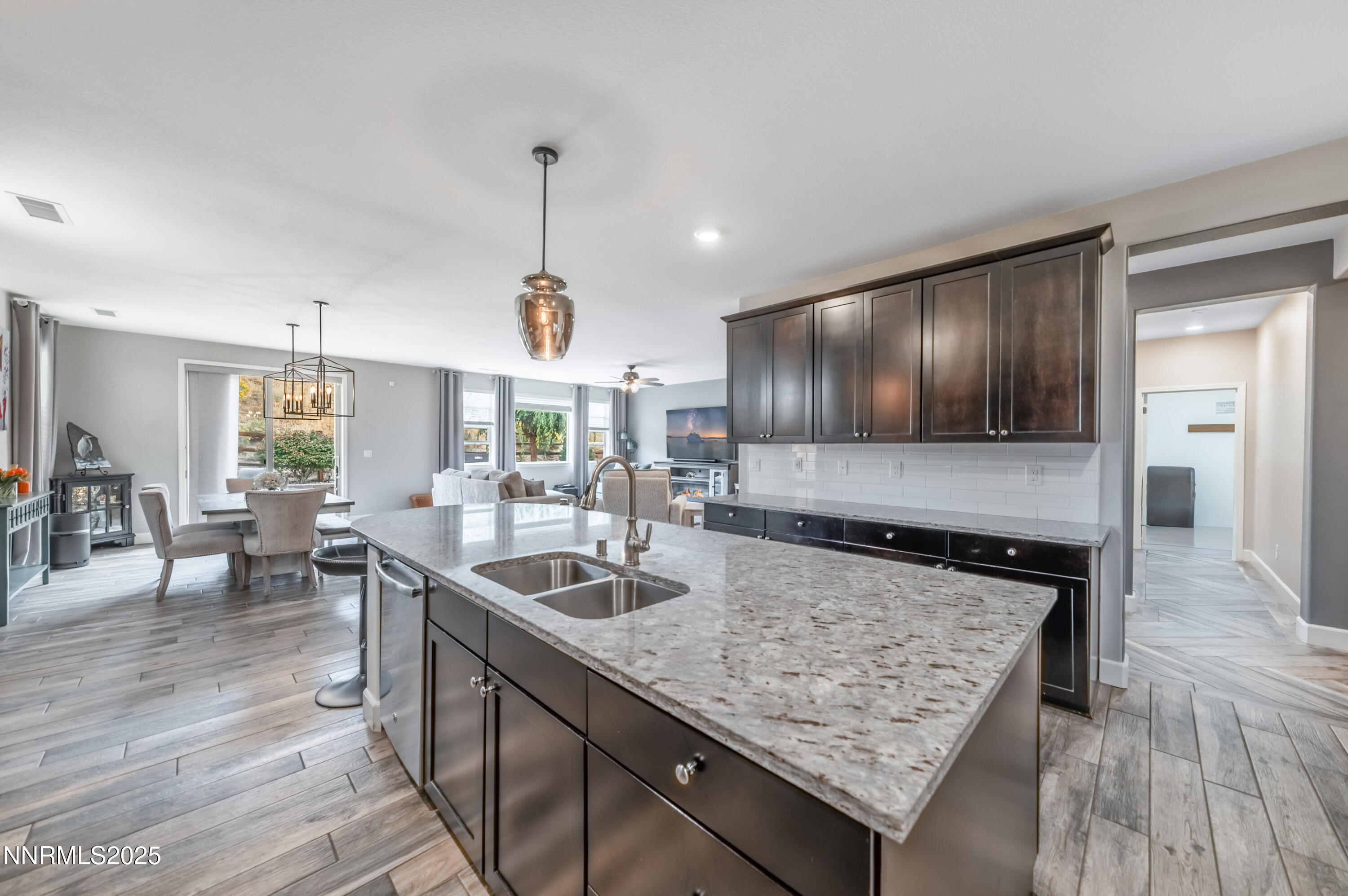 1640 Scott Valley Road Reno, NV 89523 - Photo 7 of 25 a kitchen with stainless steel appliances granite countertop sink stove and wooden floor