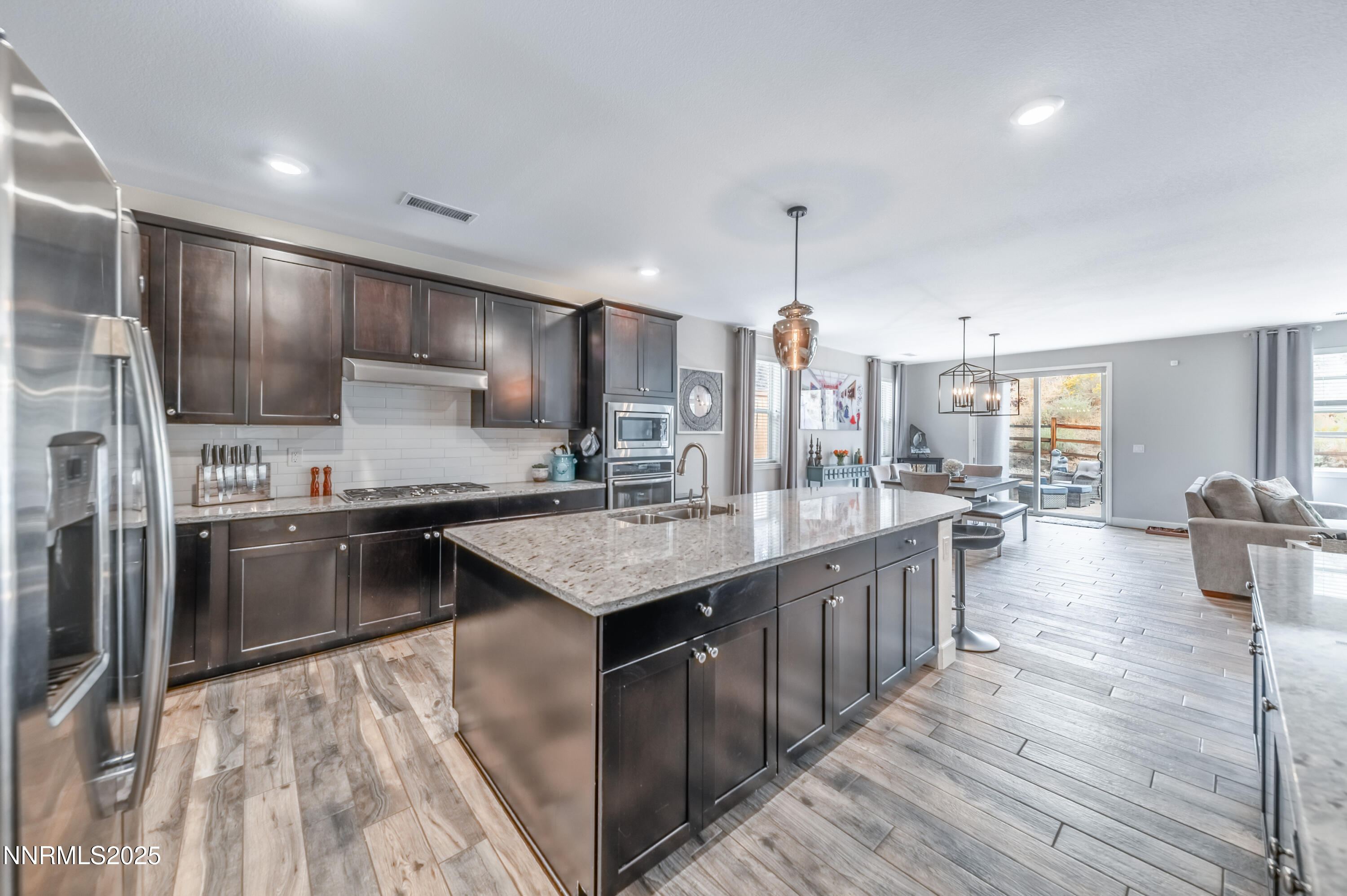 1640 Scott Valley Road Reno, NV 89523 - Photo 8 of 25 a kitchen with counter top space cabinets and stainless steel appliances