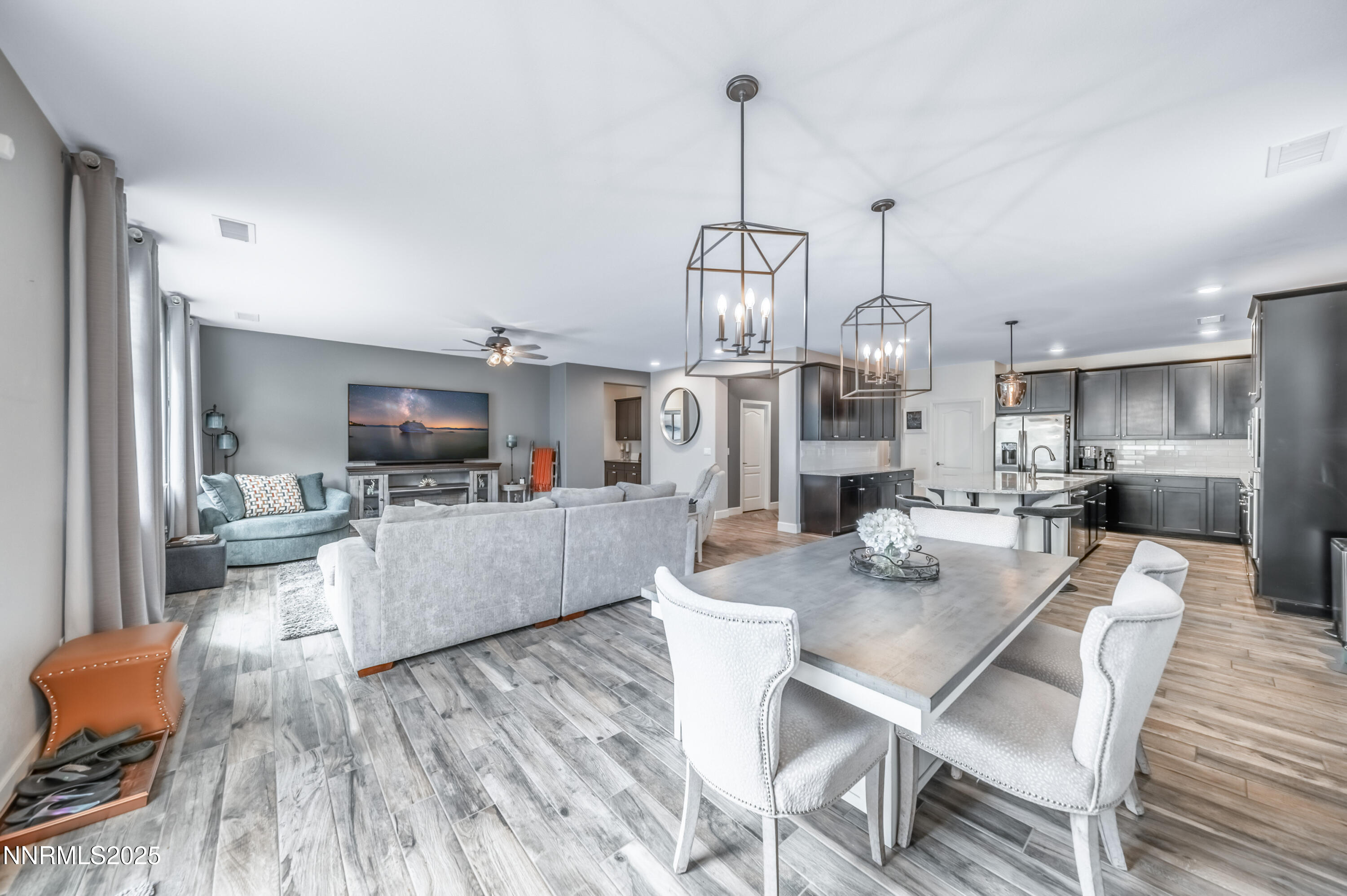1640 Scott Valley Road Reno, NV 89523 - Photo 9 of 25 a view of a dining room and livingroom with furniture wooden floor kitchen chandelier