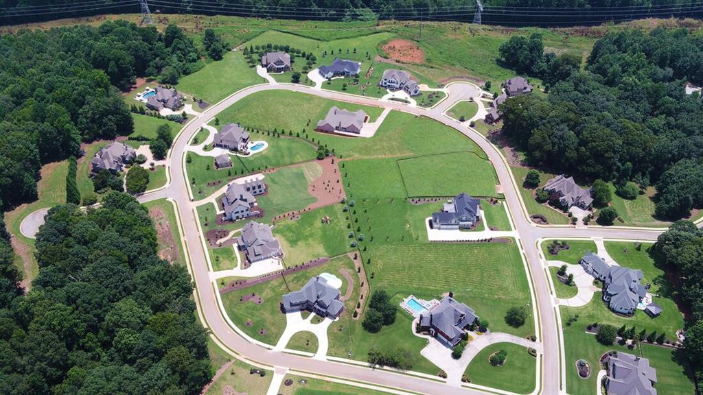 5427 Planting Field Lane Flowery Branch, GA 30542 - Photo 3 of 7 an aerial view of a house a yard and outdoor seating
