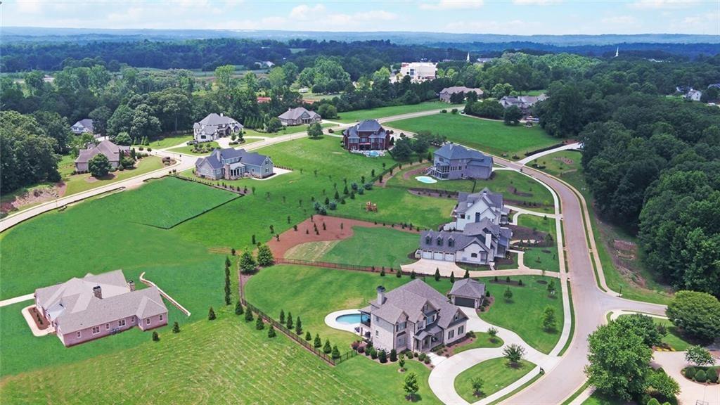 5427 Planting Field Lane Flowery Branch, GA 30542 - Photo 5 of 7 an aerial view of a golf course with outdoor space