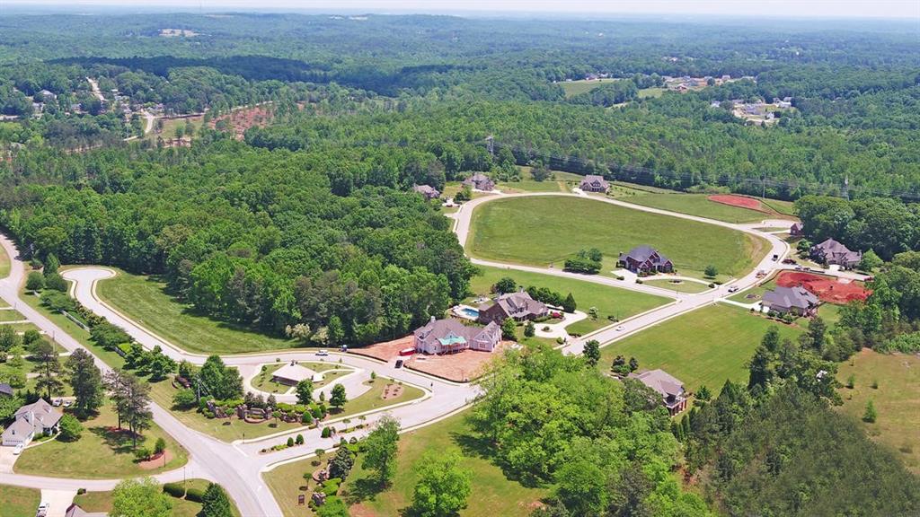 5427 Planting Field Lane Flowery Branch, GA 30542 - Photo 7 of 7 an aerial view of a swimming pool a yard and mountain view