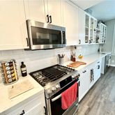 a kitchen with a stove and a microwave