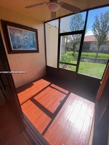 a view of a room with a large window