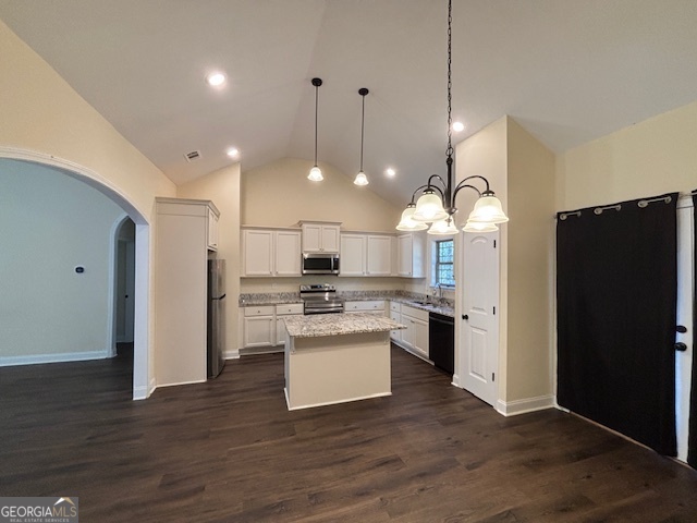 1234 Stapleton Acres Road Stapleton, GA 30823 - Photo 15 of 22 a kitchen with a refrigerator a sink dishwasher a stove and white cabinets with wooden floor