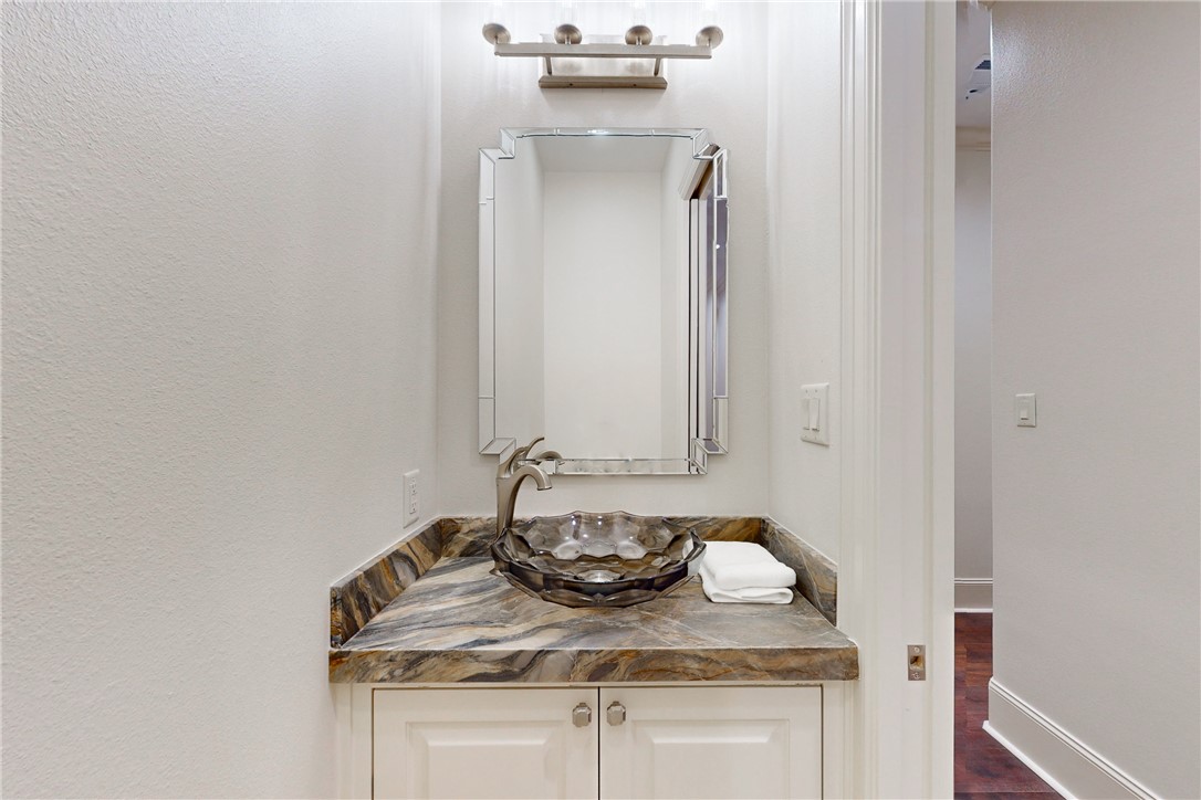 3317 Legacy Court Bryan, TX 77802 - Photo 22 of 28 a bathroom with a sink and a mirror