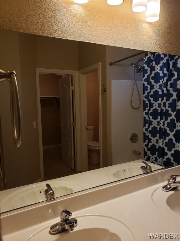 2803 Sunken Ship Street, Unit 89029 Laughlin, NV 89029 - Photo 22 of 35 a bathroom with a sink and a mirror
