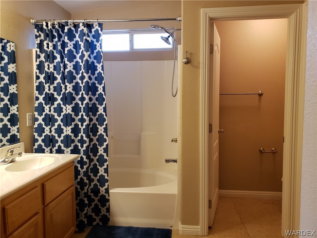 2803 Sunken Ship Street, Unit 89029 Laughlin, NV 89029 - Photo 24 of 35 a bathroom with a bathtub and shower