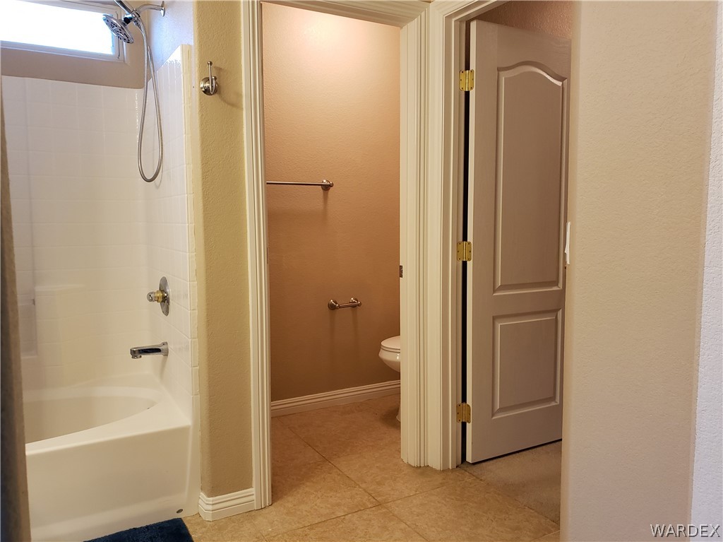 2803 Sunken Ship Street, Unit 89029 Laughlin, NV 89029 - Photo 25 of 35 a bathroom with a tub and shower