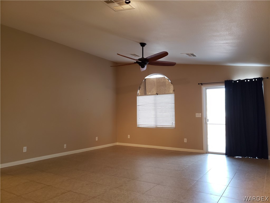 2803 Sunken Ship Street, Unit 89029 Laughlin, NV 89029 - Photo 8 of 35 an empty room with windows and fan